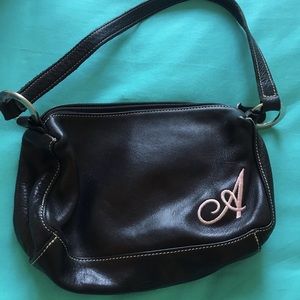Roots black handbag with “A”